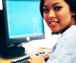 Woman Asian at computer copy